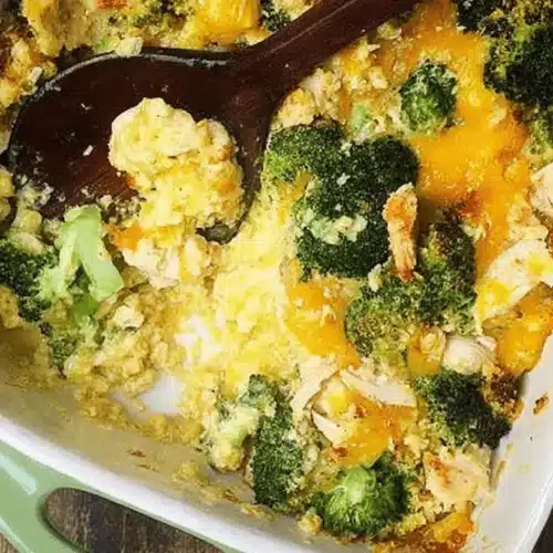 Close-up of a warm, golden-brown Easy Low Carb Chicken Casserole with broccoli and melted cheese, served on a rustic wooden table.